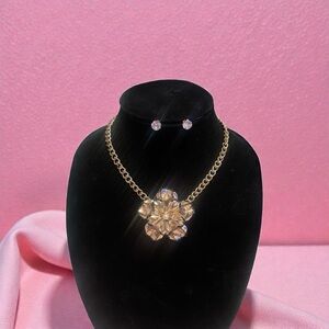 Chunky gold-tone flower statement necklace and matching stud earrings